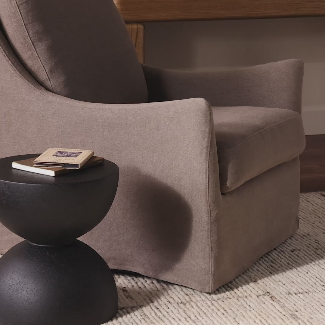 Four Hands Monette Glider Swivel in Broadway Coffee in a living room at Addison West