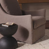 Four Hands Monette Glider Swivel in Broadway Coffee in a living room at Addison West