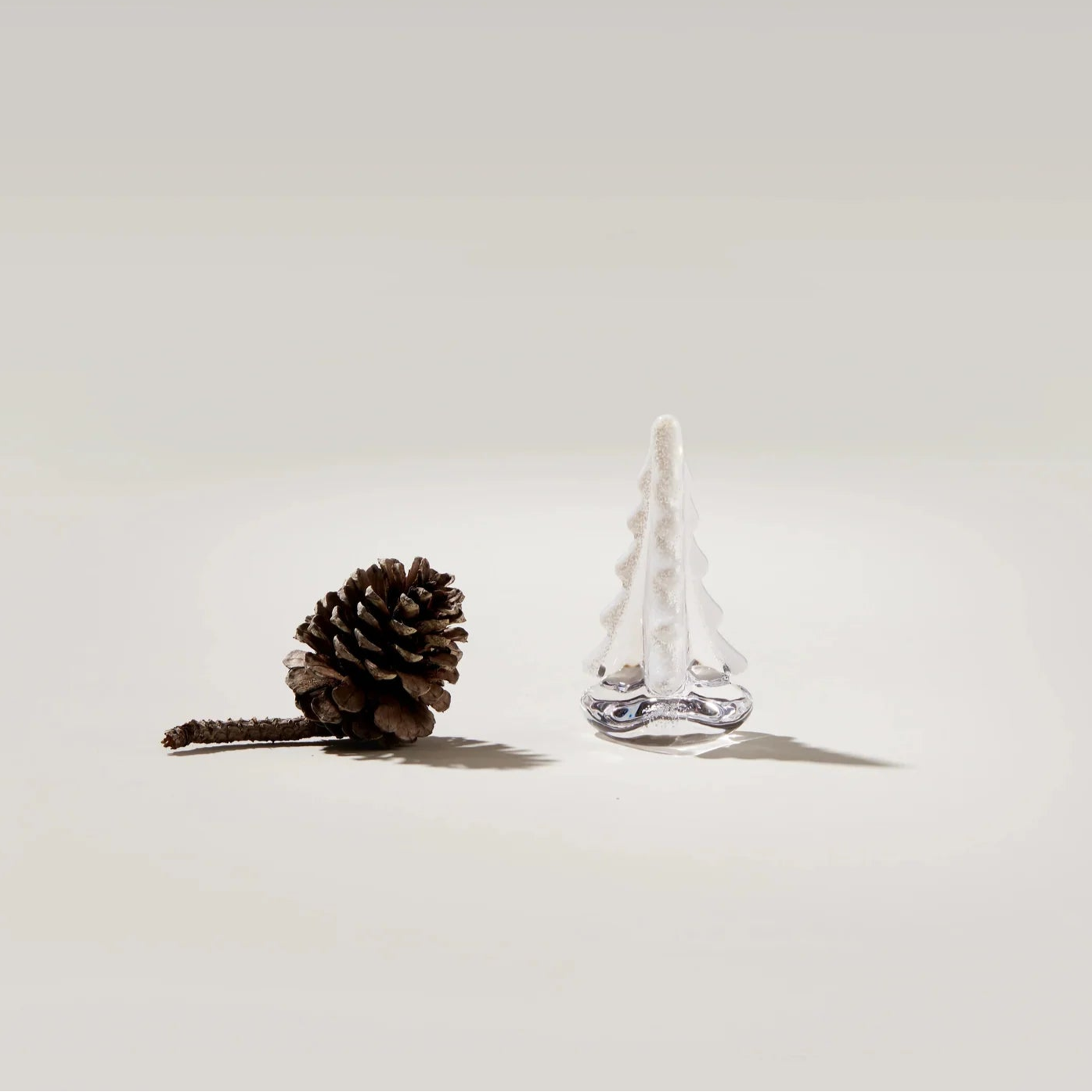Snowy Branches Evergreen Glass Tree, 4" on a white background at Addison West