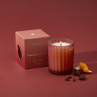 Thymes Pomander Clove Candle 6.1 oz on a red background at Addison West