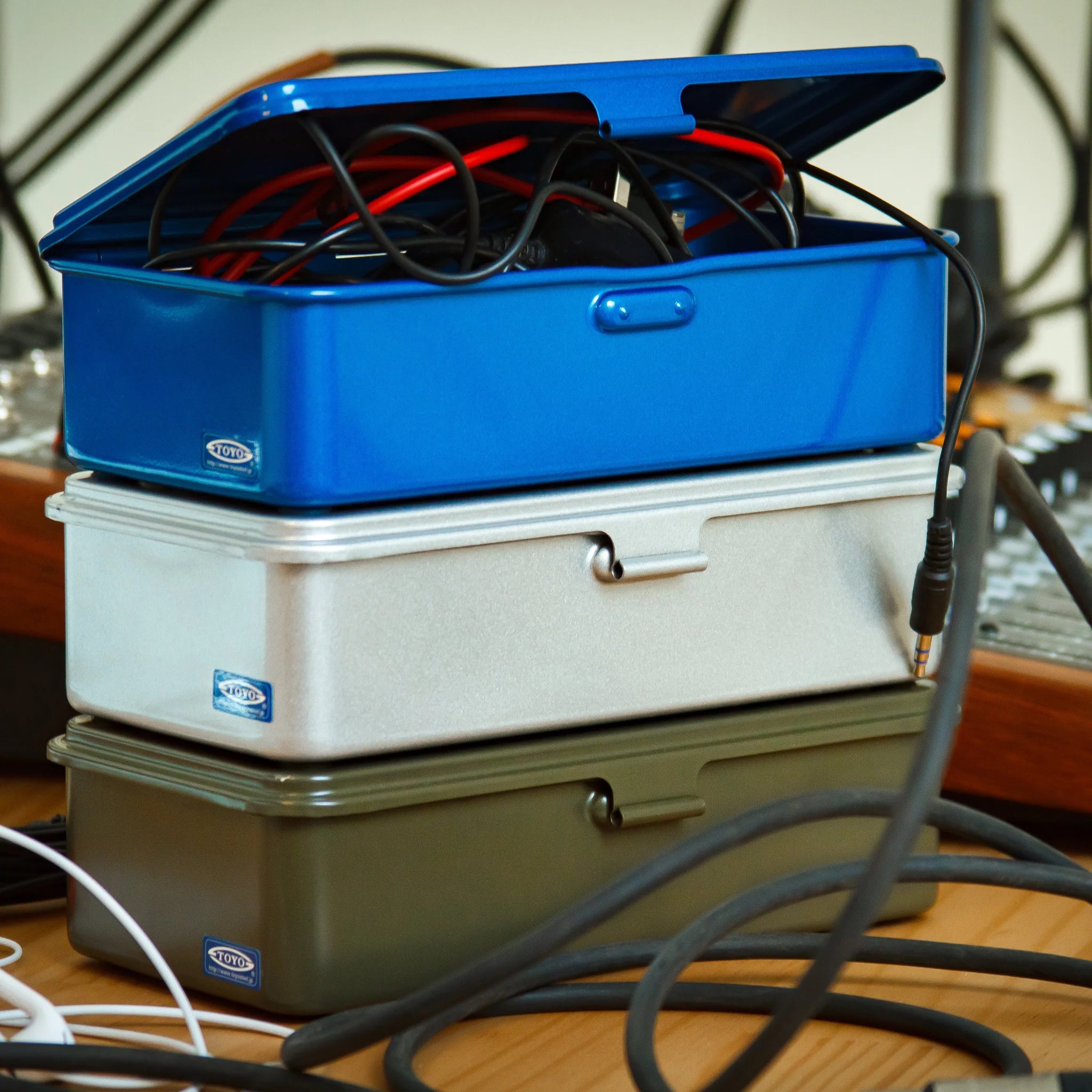 Toyo Steel Stackable Storage Box T-190 in Blue on a table at Addison West