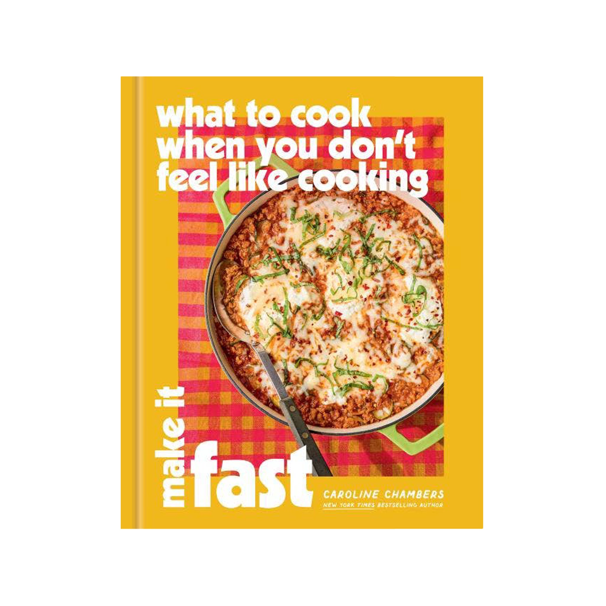 The front cover of the cookbook 'make it fast: what to cook when you don't feel like cooking' by Caroline Chambers. The cover features a bright yellow background, a red and pink checkered pattern, and a photo of a baked pasta dish in a pan.