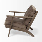 Wood arm chair with dark brown stain and olive velvet removable cushions on a white background