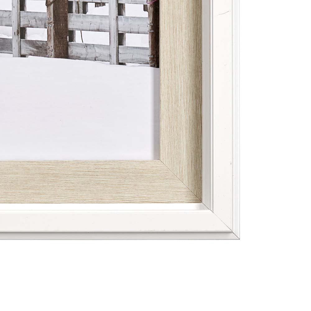 Close up of frame on Rustic wood barn in snow framed art print on a white background
