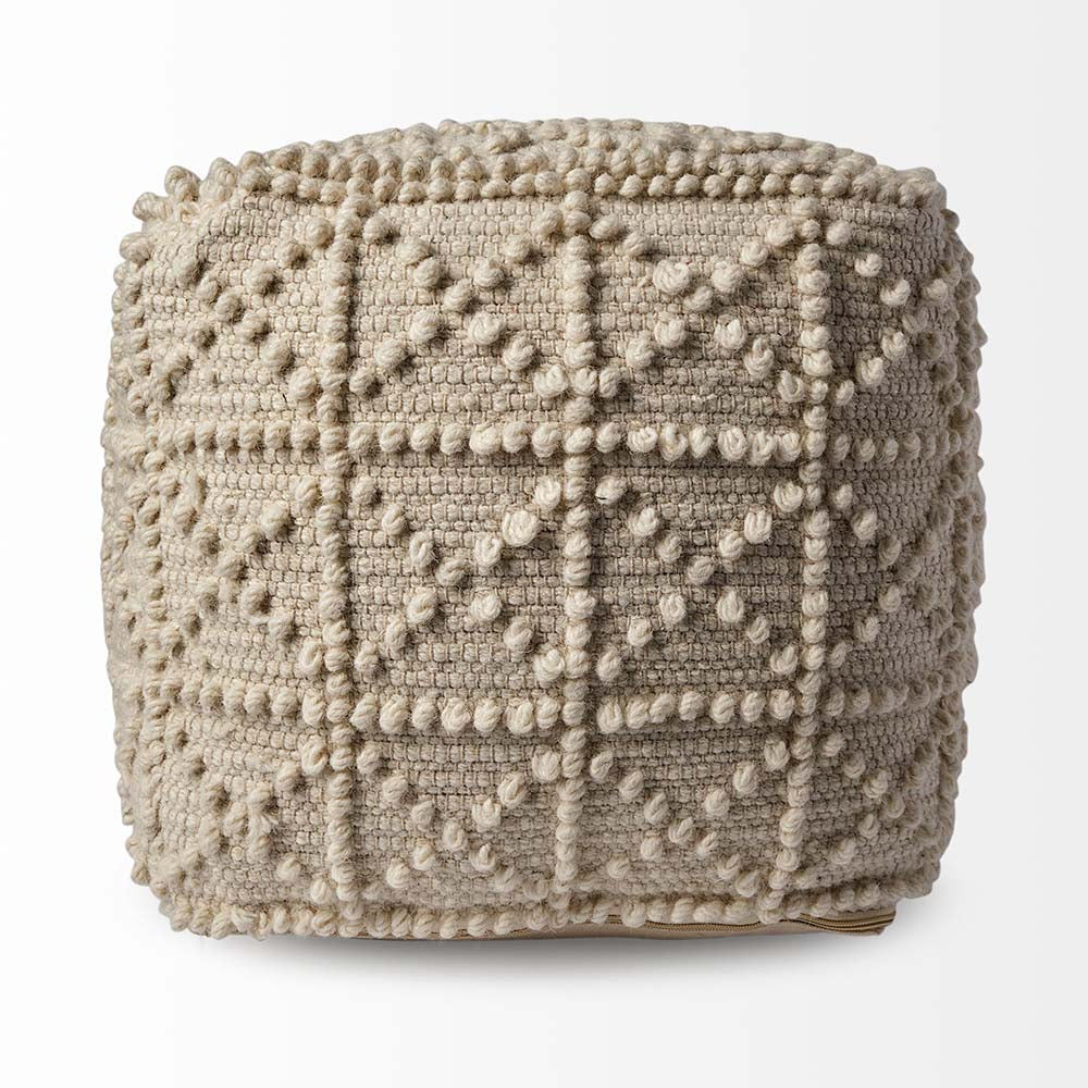 Cream wool Leroy pouf with popcorn design on a white background