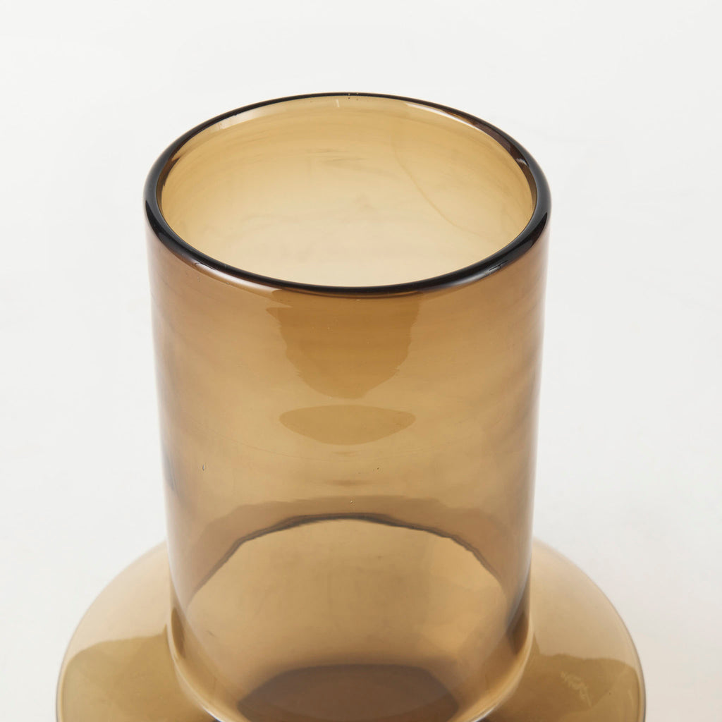 Amber glass vase with modern shape on a white background  Edit alt text