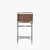 Back view of Four hands brand wharton counter stool with black iron frame and dark brown leather seat on a white background