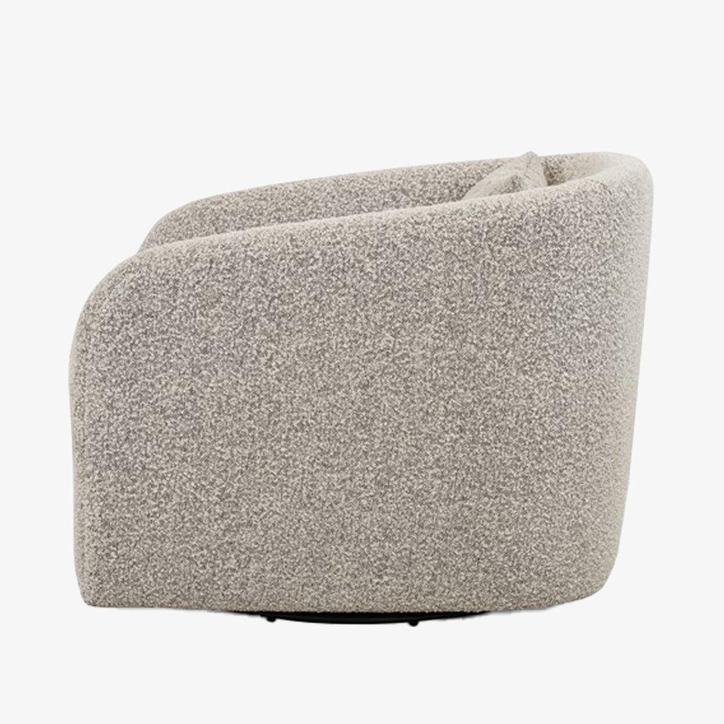 Side view of Four hands brand Topanga swivel chair with boucle grey and creme fabric on a white background