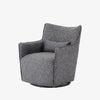 Charcoal grey small swivel armchair by four hands furniture on a white background