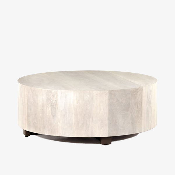 'Hudson' round coffee table by four hands furniture in light wood Ashen walnut color with dark wood legs on a white background