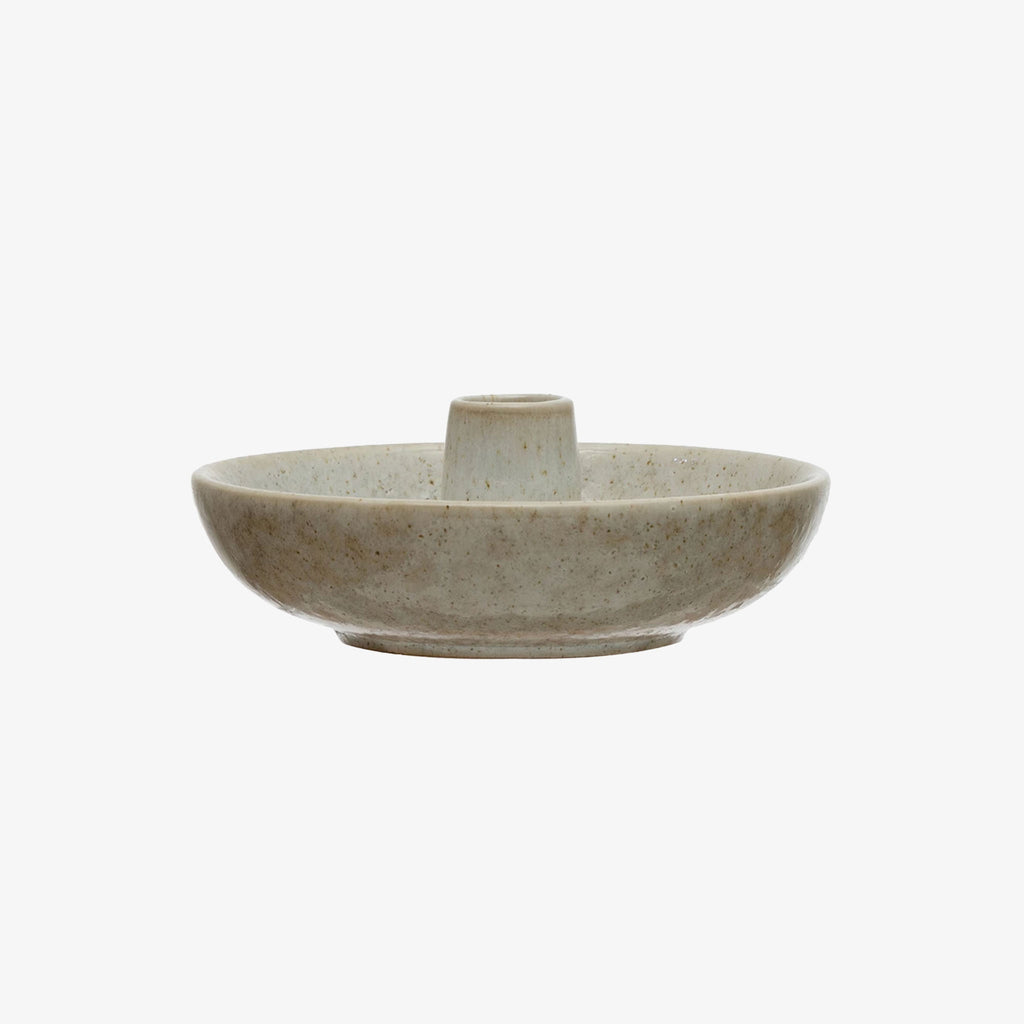 Stoneware holder for toothpicks or candle on a white background
