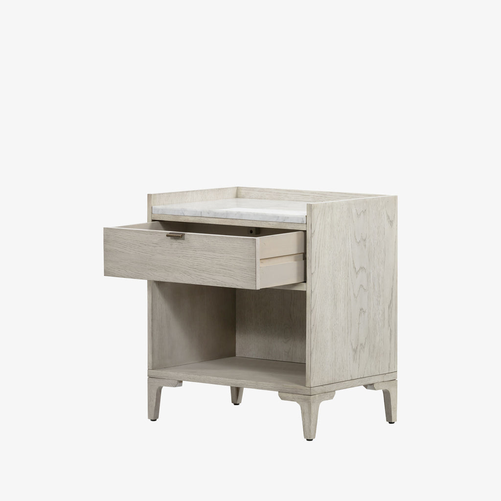 Whitewashed nightstand with drawer and marble top on a white background