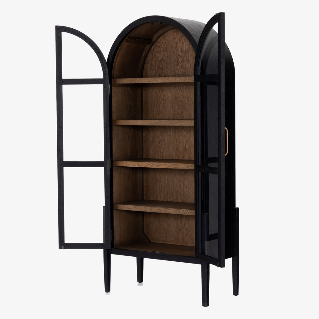 Four hands furniture brand Tolle black cabinet with arched top and wood stained interior and two glass doors on a white background  