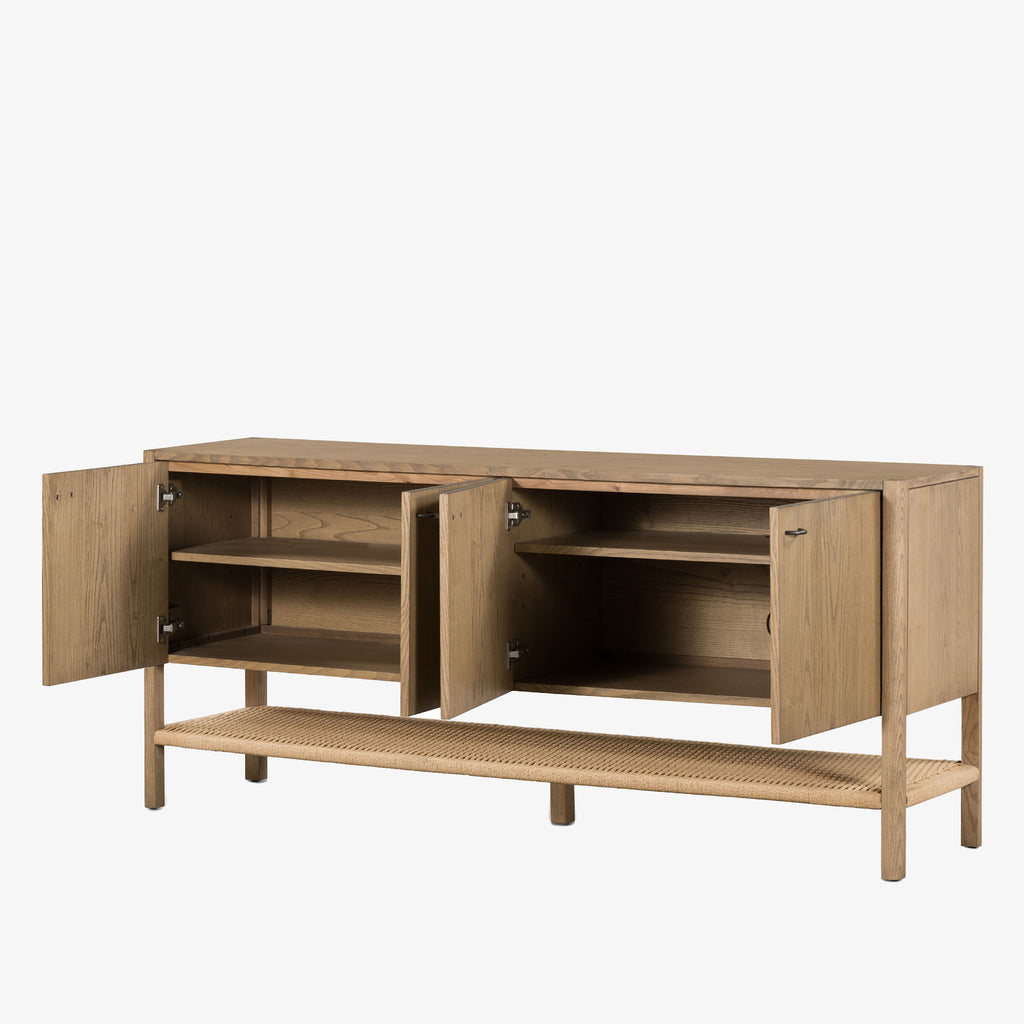 Wood four door 'Zuma' sideboard with shelf underneath by four hands furniture on a white background