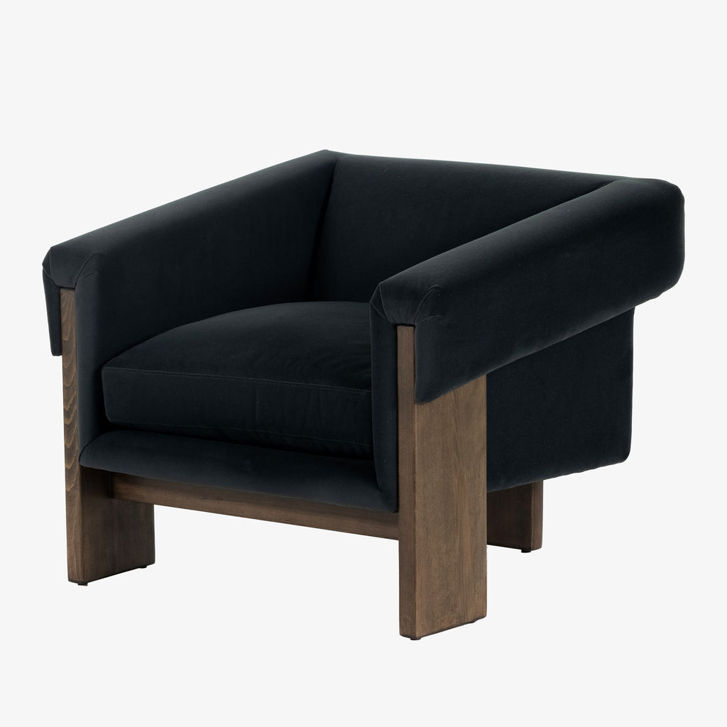 Four Hands Furniture brand Cairo chair in dark blue velvet with dark wood legs on a white background