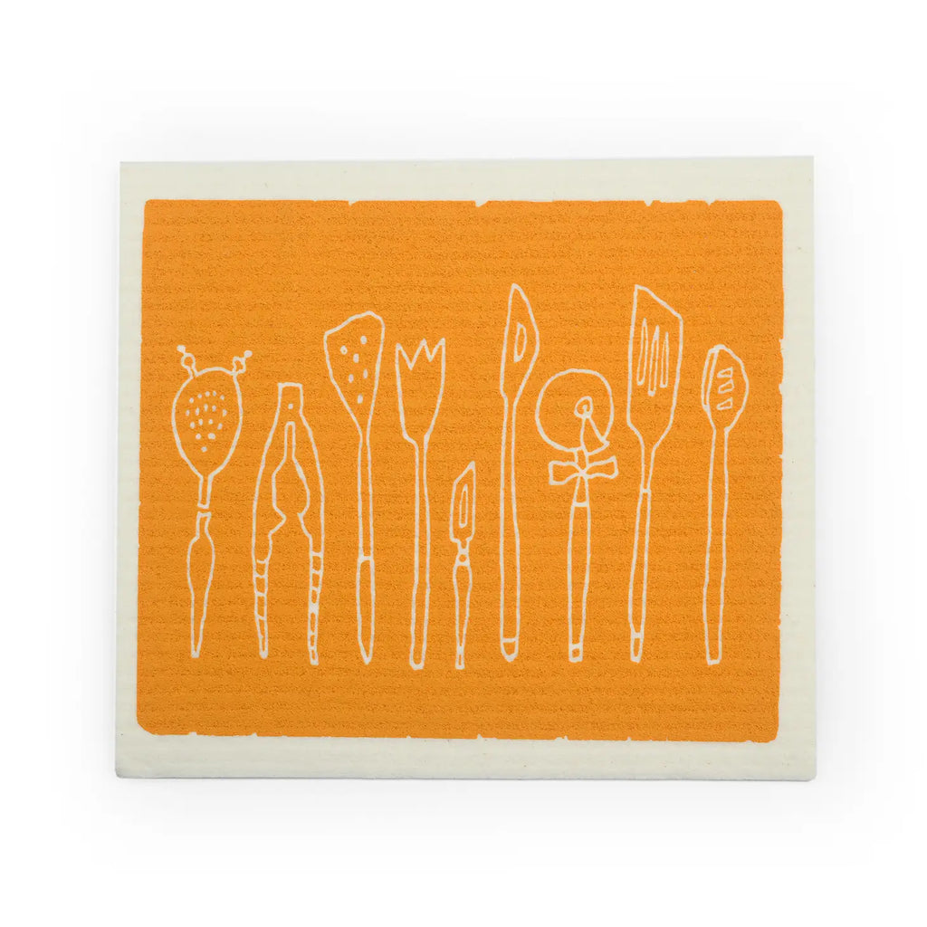 Swedish cloth sponge with kitchen utensils in a row and yellow background