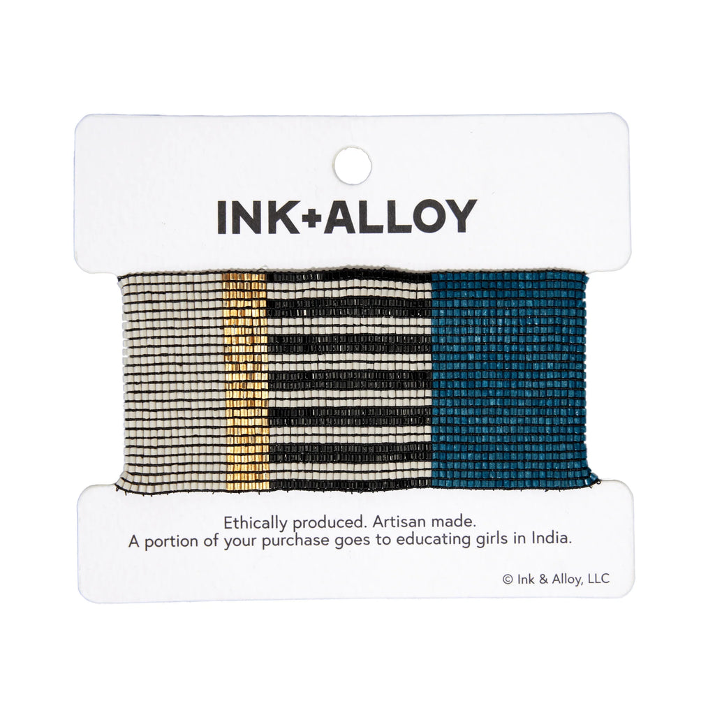 Ink and alloy brand 'Brooklyn' stretch bracelet in blue and black peakock' on a white background