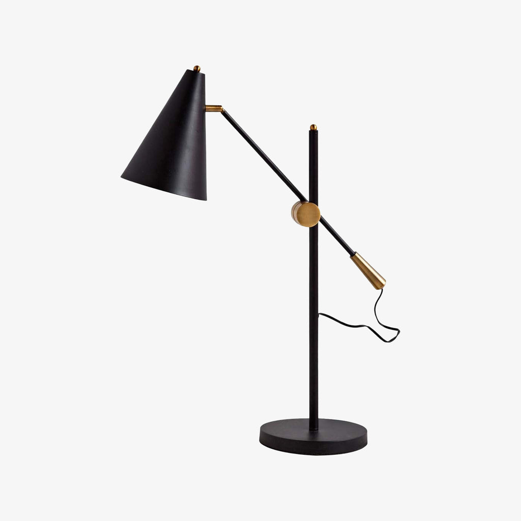 Mercana fragone desk lamp in black with brass accents on a white background