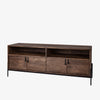 Brown wood media console with black metal legs and four doors and rustic pulls on a white background