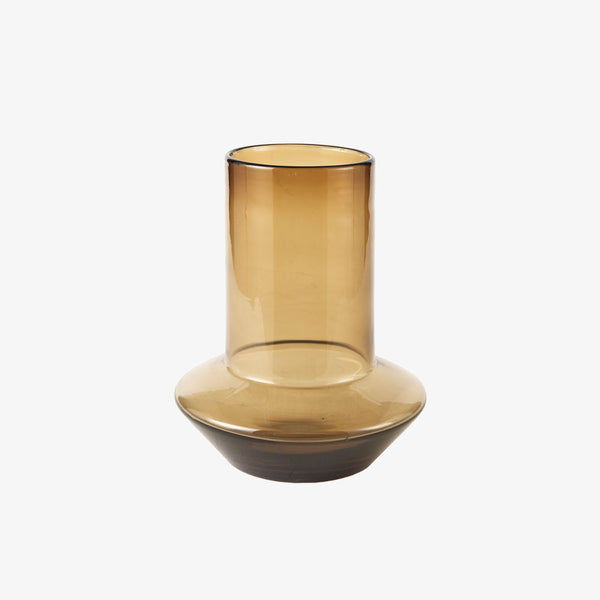 Amber glass vase with modern shape on a white background