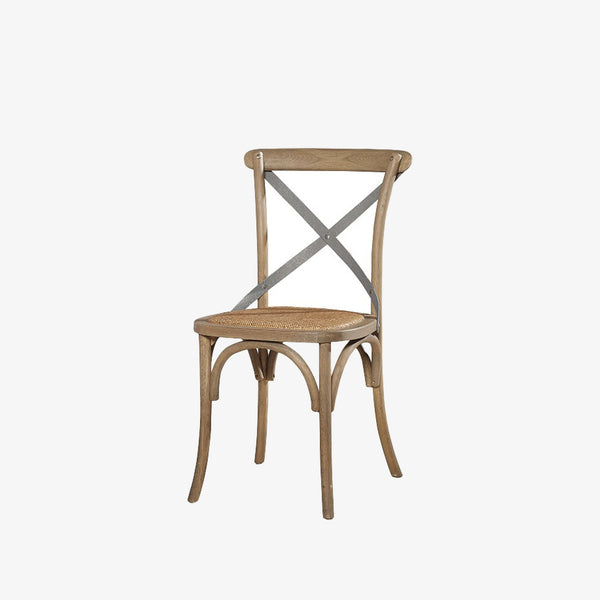 Parisian bistro style dining chair with rattan seat and two metal back braces on a white background