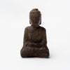 Hand carved Bluestone Buddha on a white background