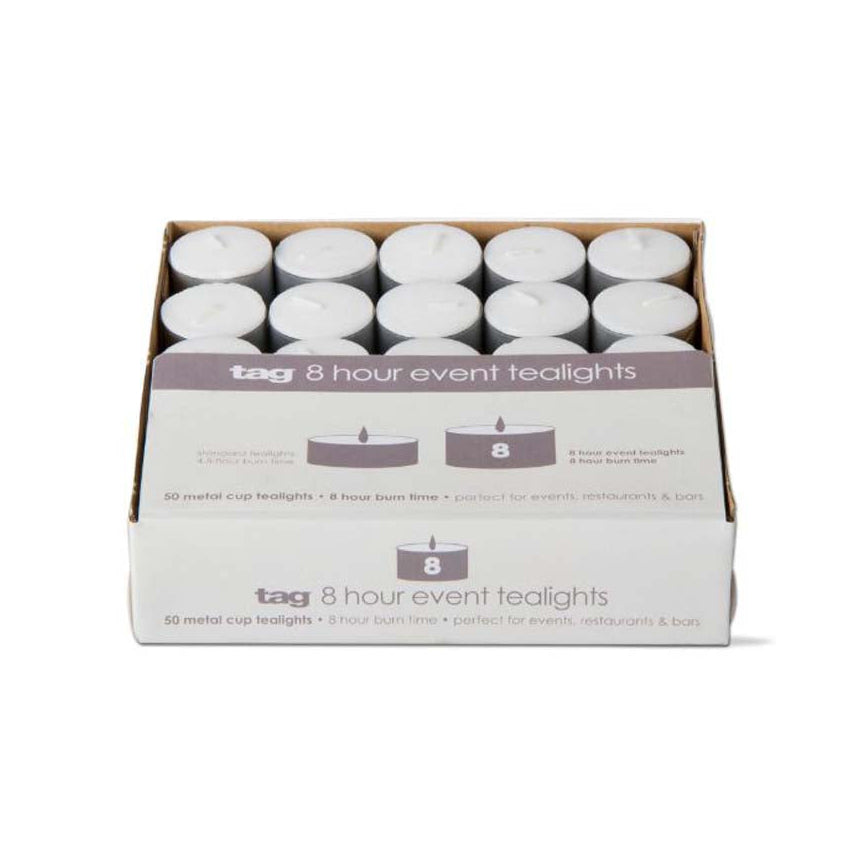 white tea candles in metal cups