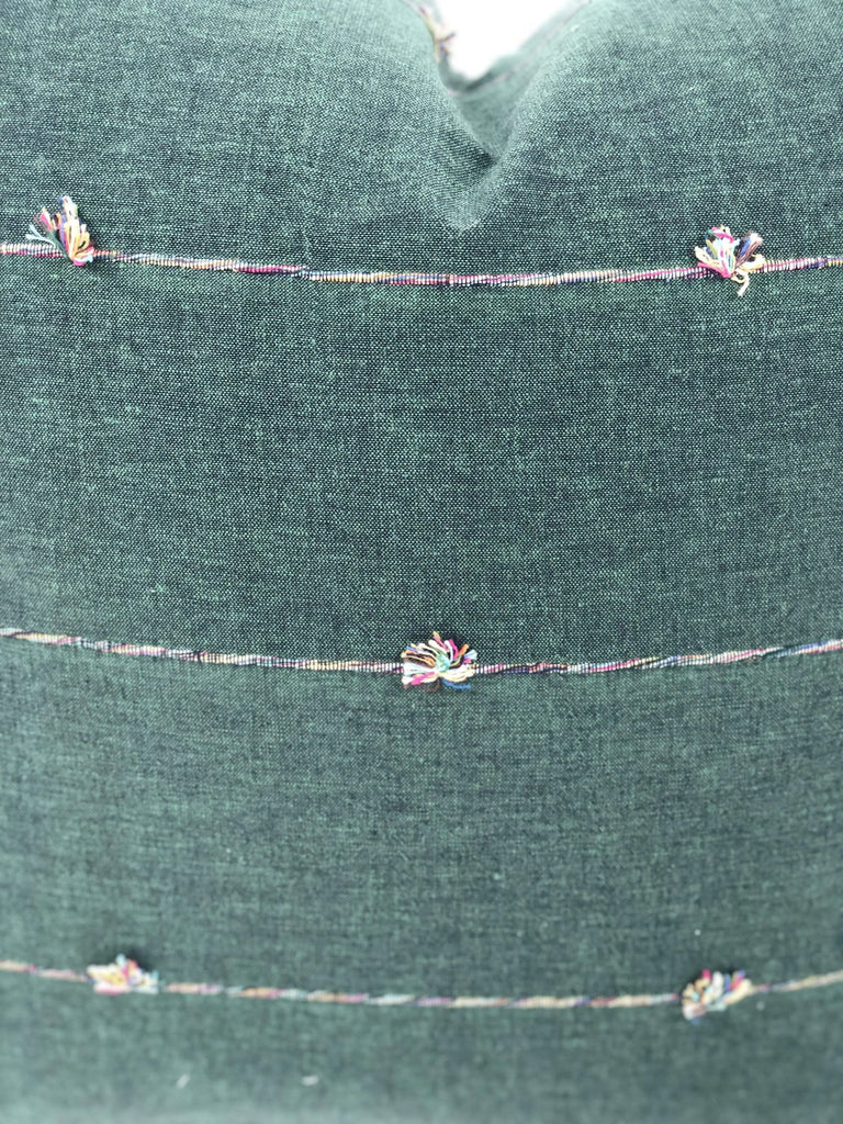Close up of fabric details on Square green throw pillow 