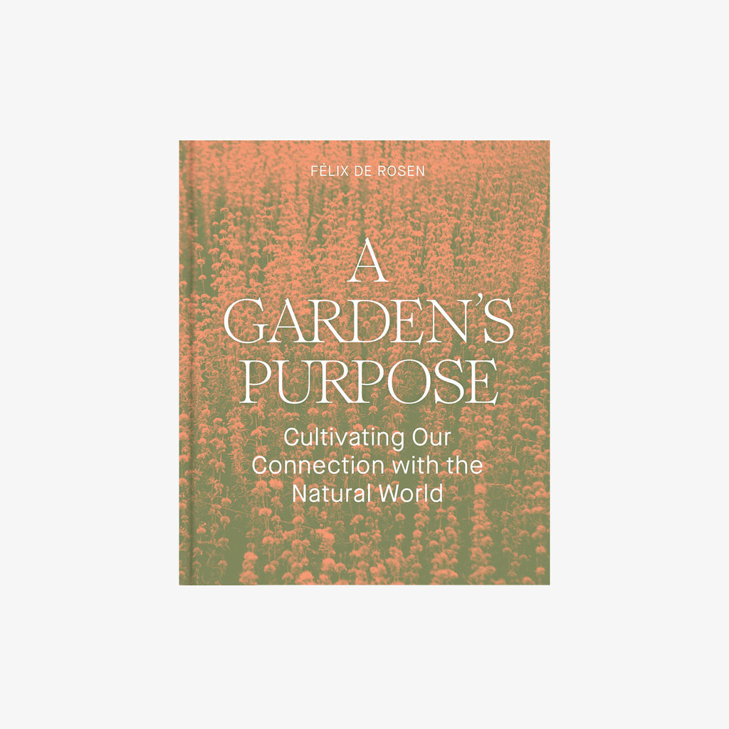 Front cover of book titled 'a garden's purpose' with pink flowers and green grass on a white background