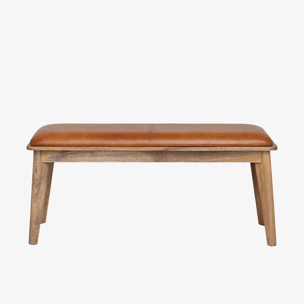 Wood bench with leather seat cushion on a white background