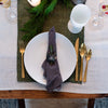 Table setting with Stainless steel brass colored flatware set of four pieces 