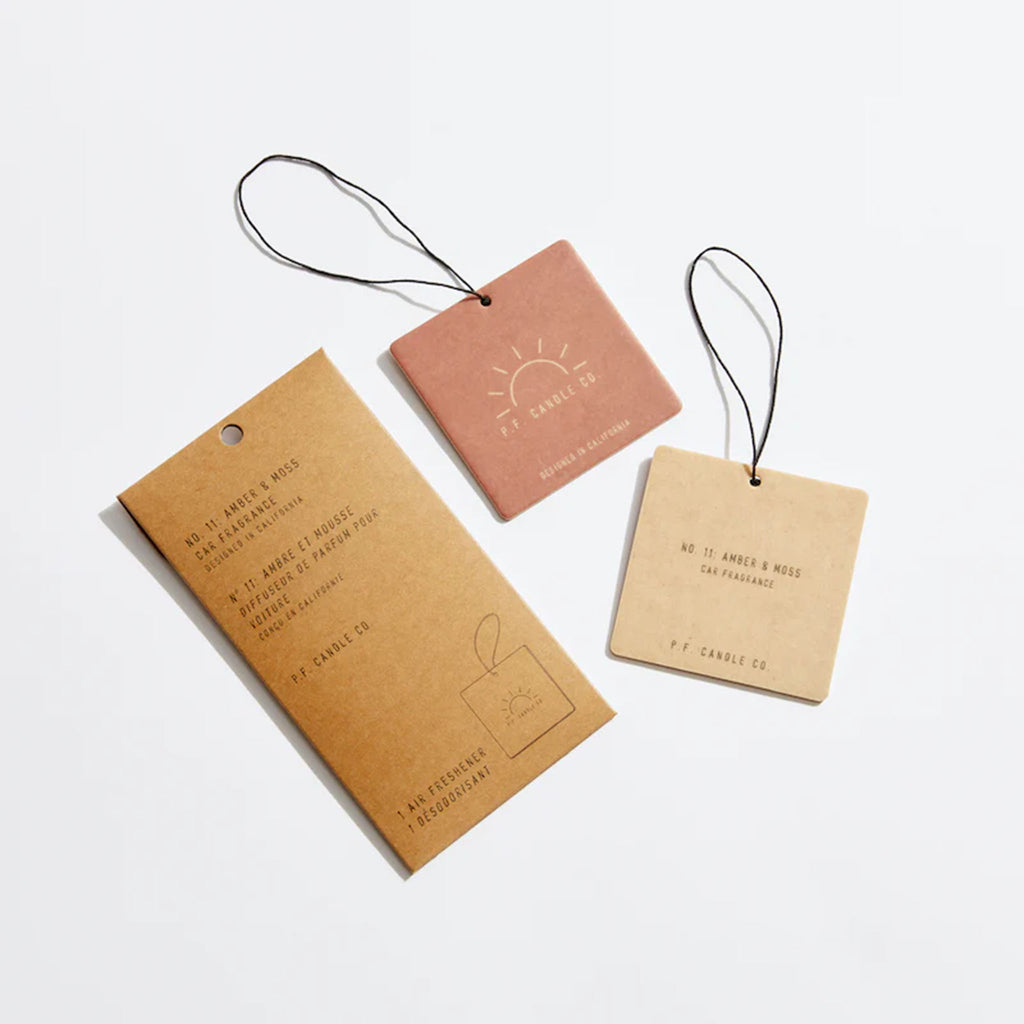 PF Candle Amber and Moss Car Fragrance hang tags on a white background
