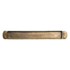 Long and narrow brass toned tray with handles on a white background