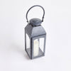 Zinc metal square outdoor lantern with arched top handle on a white background