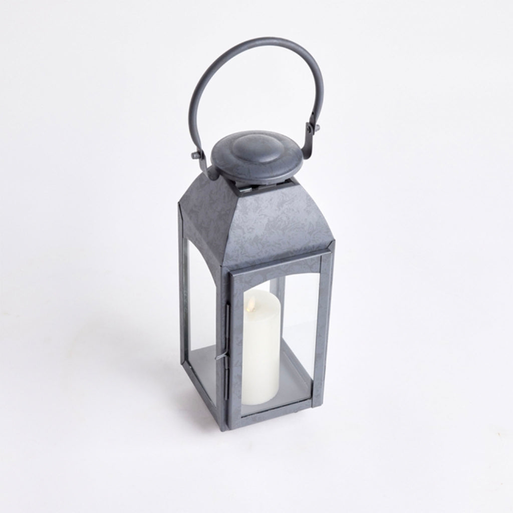 Zinc metal square outdoor lantern with arched top handle on a white background