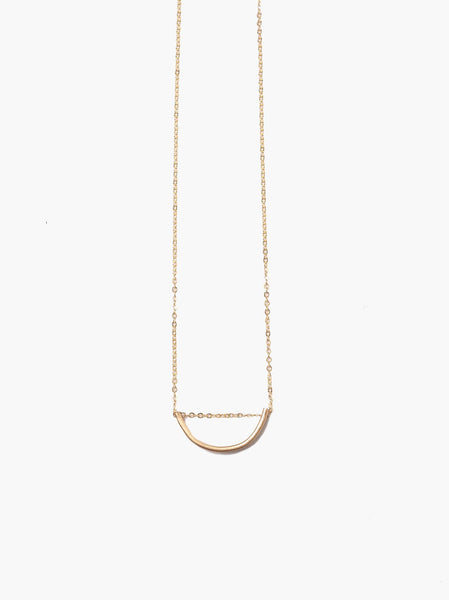Able brand 14k gold filled Arch necklace on a white background