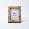 Close up of 4x6 sisal picture frame on a white background