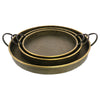 Set of three round galvanized metal trays with handles and brass edging on a white background
