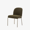 Four Hands Brand Astrud dining chair with boucle olive fabric seat and back and iron legs on a white background