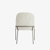 Four Hands Brand Astrud dining chair with pewter fabric seat and back and iron legs on a white background