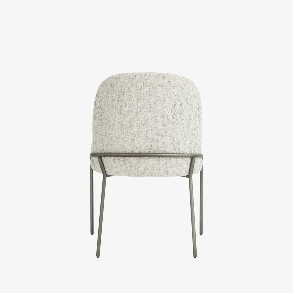 Four Hands Brand Astrud dining chair with pewter fabric seat and back and iron legs on a white background