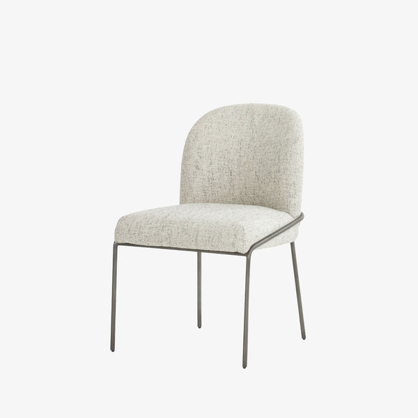 Four Hands Brand Astrud dining chair with pewter fabric seat and bag and iron legs on a white background