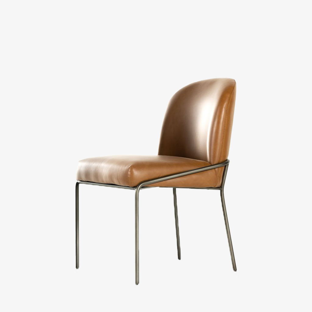 Four Hands Brand Astrud dining chair with brown leather seat and back and iron legs on a white background