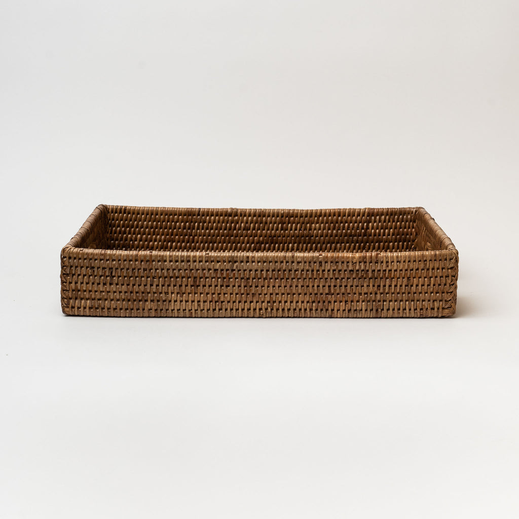 Rattan rectangular tray with two cut out hands on white background