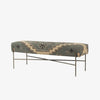 Long bench with patterned wool seat cover in muted charcoal green and cream on a white background