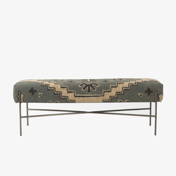Long bench with patterned wool seat cover in muted charcoal green and cream on a white background