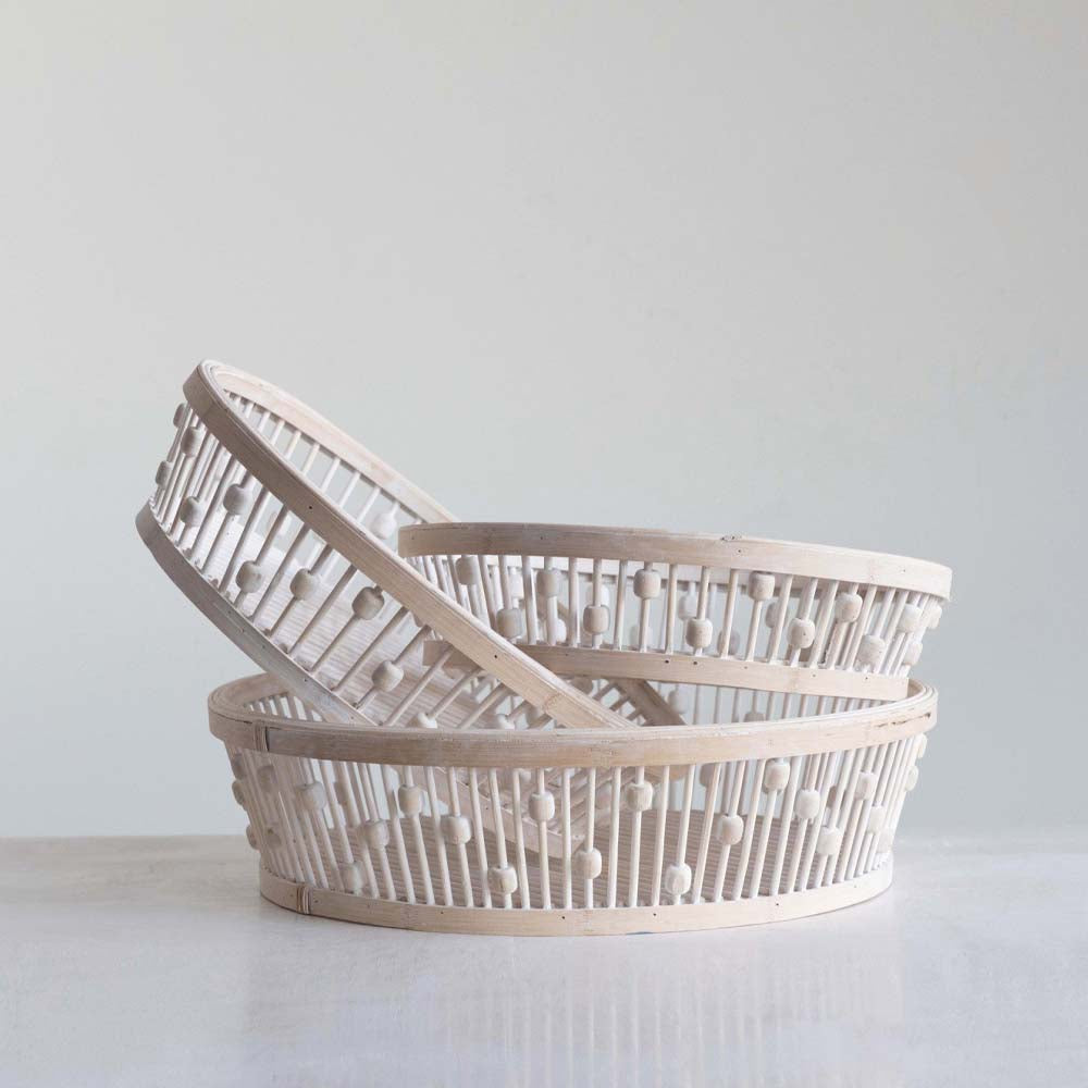set of three nested banded baskets in white washed wood