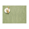 Chilewich Bamboo Signature Rectangle Placemat in spring green color on a white background with a small plate and wood spoon