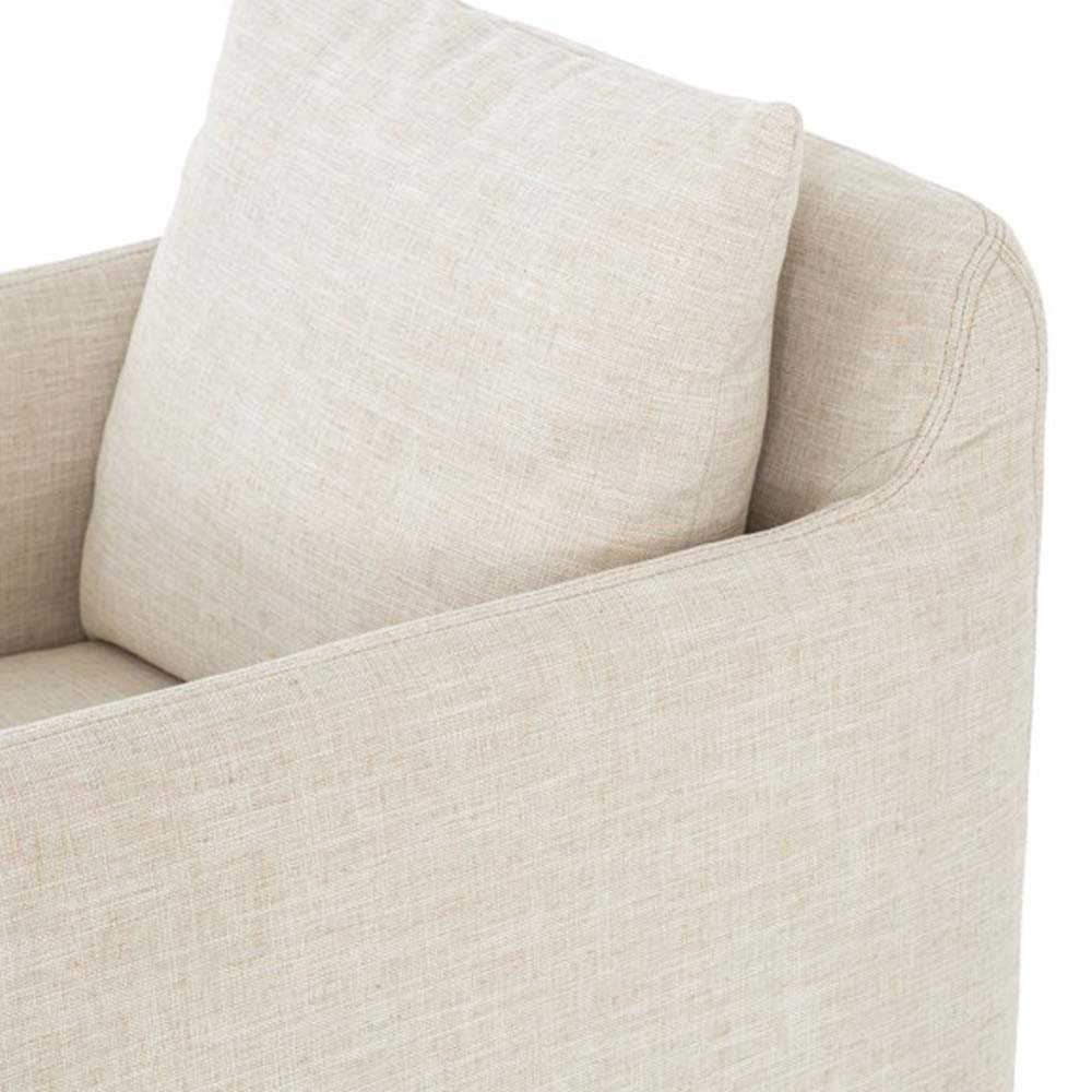 Close up view of Four hands furniture brand Banks swivel chair in cambric ivory on a white background