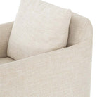 Close up view of Four hands furniture brand Banks swivel chair in cambric ivory on a white background